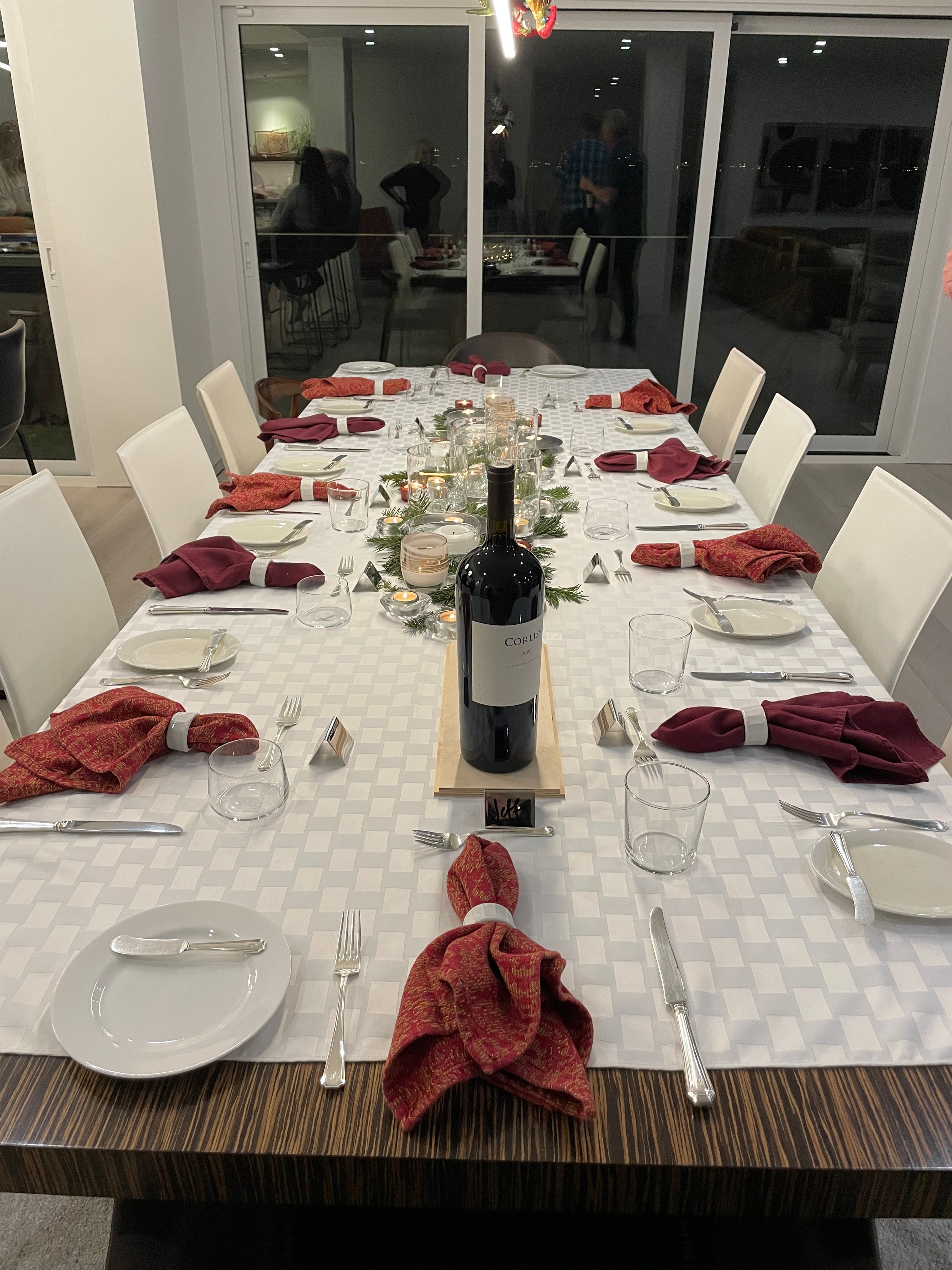 Elegant dining table with burgundy napkins and glassware